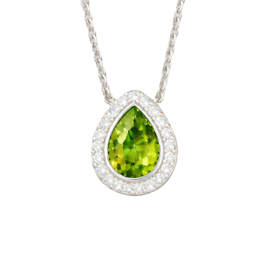 Green sapphire halo pendant with 7×5 mm pear cut in white gold-plated 925 silver, accented with moissanite. Elegant and refined. Available now at BSI Jewelry.