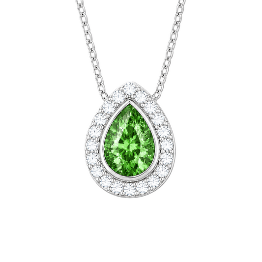 Green sapphire halo pendant with 7×5 mm pear cut in white gold-plated 925 silver, accented with moissanite. Elegant and refined. Available now at BSI Jewelry.