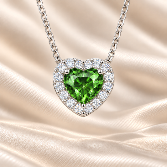 Green sapphire heart necklace with 6 mm center stone in white gold-plated 925 silver. Fresh and elegant for everyday wear. Available now at BSI Jewelry.