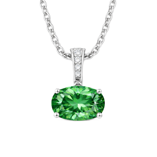 Green sapphire oval pendant with an 8×5 mm gemstone in white gold-plated 925 silver, accented with moissanite. Elegant and refined. Available now at BSI Jewelry.