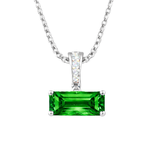 Green sapphire pendant with an 8×5 mm baguette in white gold-plated 925 silver, accented with moissanite. Elegant and refined. Available now at BSI Jewelry.