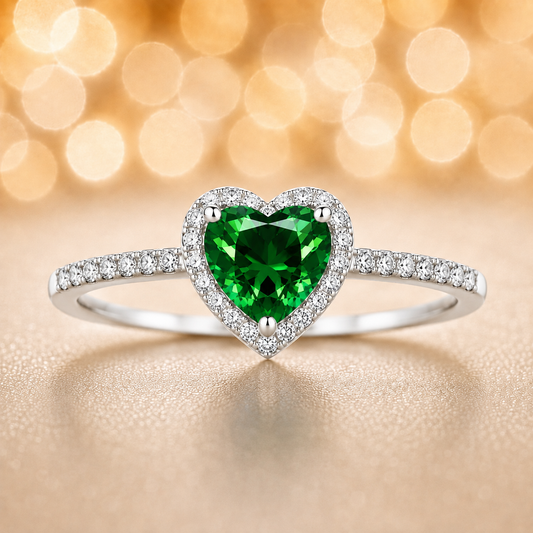 Green sapphire ring with a 6 mm heart cut, accented by moissanite in white gold-plated 925 silver. Elegant and timeless. Available now at BSI Jewelry.