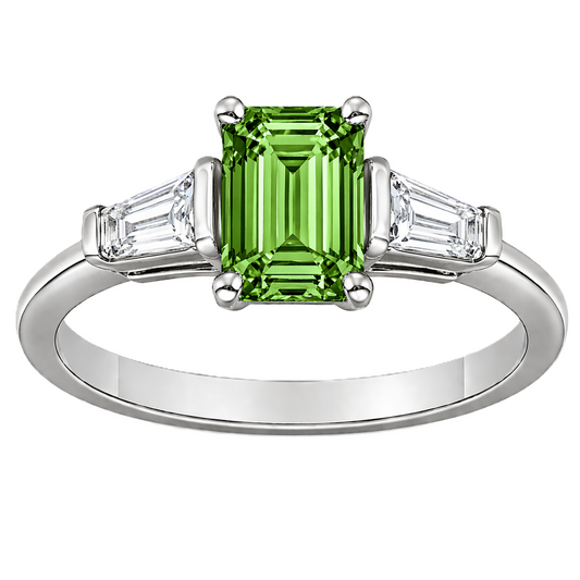 Green sapphire ring, 7×5 mm emerald cut with tapered moissanite, crafted in white gold-plated 925 silver. Elegant and timeless. Available now at BSI Jewelry.