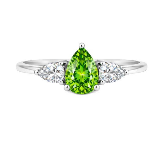 Green sapphire ring with 7×5 mm pear center and side stones in white gold-plated 925 silver. Bright and elegant for daily wear. Available now at BSI Jewelry.