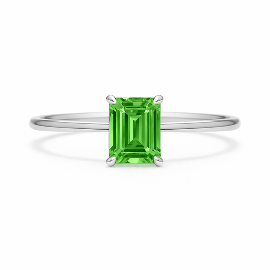 Elegant 6×4 mm emerald-cut green sapphire ring crafted in white gold-plated 925 silver with palladium alloy. Timeless brilliance. Available now at BSI Jewelry.