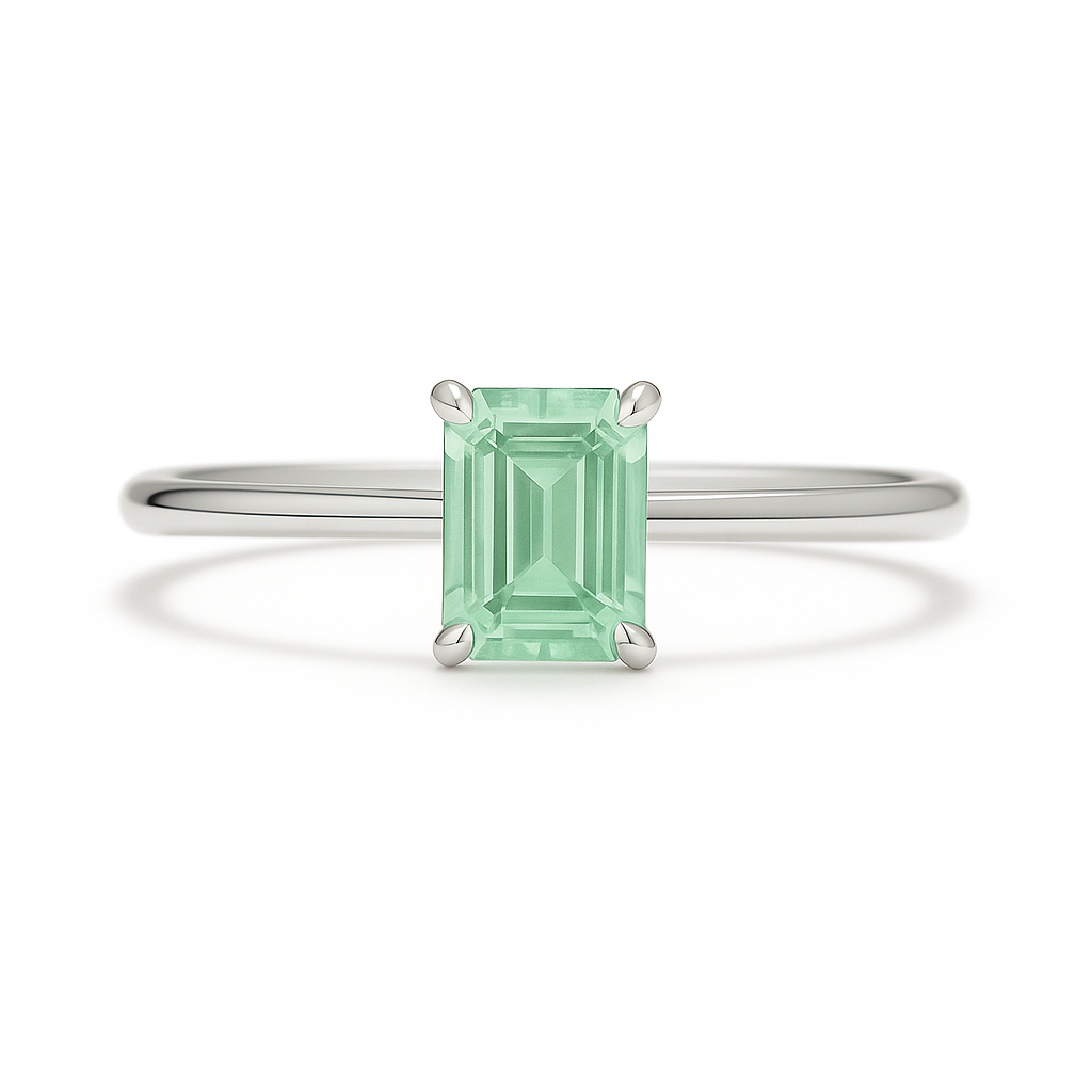Elegant 6×4 mm emerald-cut green sapphire ring crafted in white gold-plated 925 silver with palladium alloy. Timeless brilliance. Available now at BSI Jewelry.