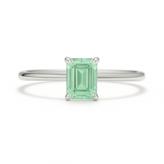 Elegant 6×4 mm emerald-cut green sapphire ring crafted in white gold-plated 925 silver with palladium alloy. Timeless brilliance. Available now at BSI Jewelry.