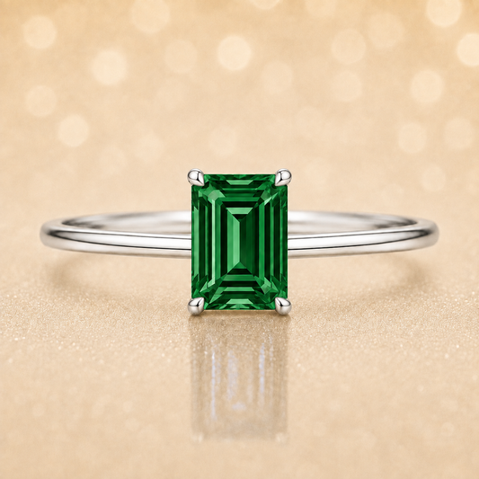 Elegant 6×4 mm emerald-cut green sapphire ring crafted in white gold-plated 925 silver with palladium alloy. Timeless brilliance. Available now at BSI Jewelry.
