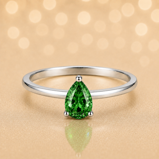 Green sapphire solitaire ring with a 6×4 mm pear in white gold-plated 925 silver. Elegant, minimal, and timeless for daily wear. Available now at BSI Jewelry.
