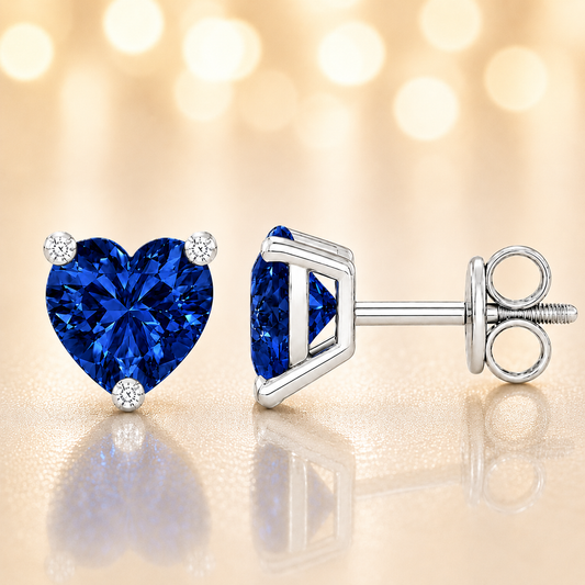 Heart blue sapphire stud earrings, 5 mm heart, crafted in white gold-plated 925 silver. Classic and elegant for daily wear. Available now at BSI Jewelry.