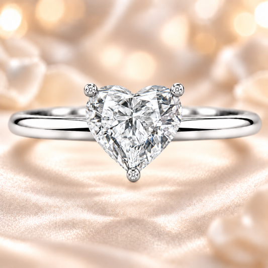 Timeless heart moissanite engagement ring with a 6 mm heart-cut center stone, crafted in white gold plated 925 silver. Available now at BSI Jewelry.