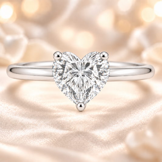 Heart Moissanite Solitaire Ring featuring an 8 mm heart-cut Moissanite in white gold plated 925 silver. Brilliant, hypoallergenic and elegant. Shop BSI Jewelry.