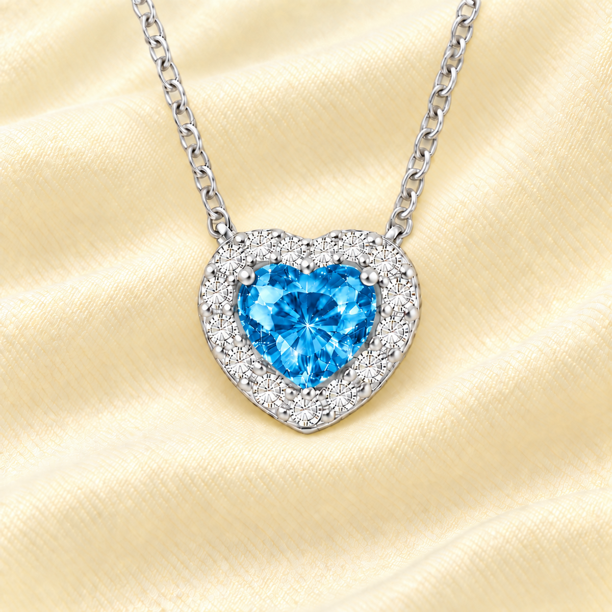 Swiss blue topaz heart necklace with a 6 mm gemstone in white gold-plated 925 silver. Elegant and hypoallergenic. Available now at BSI Jewelry.