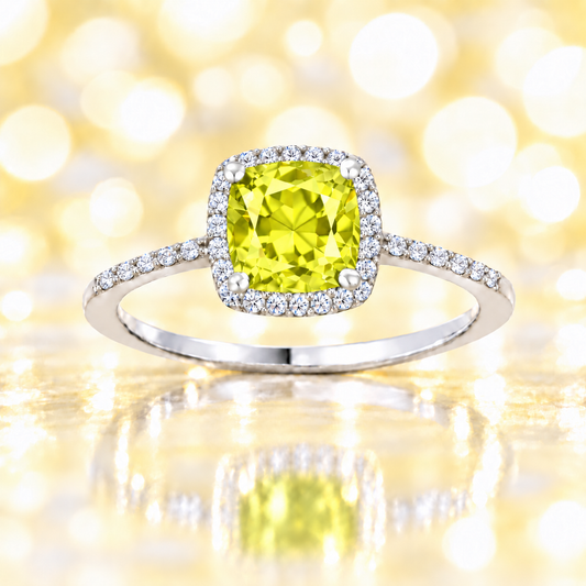 Lemon quartz ring with a 6 mm cushion-cut center in white gold-plated 925 silver, accented with moissanite for refined sparkle. Available now at BSI Jewelry.