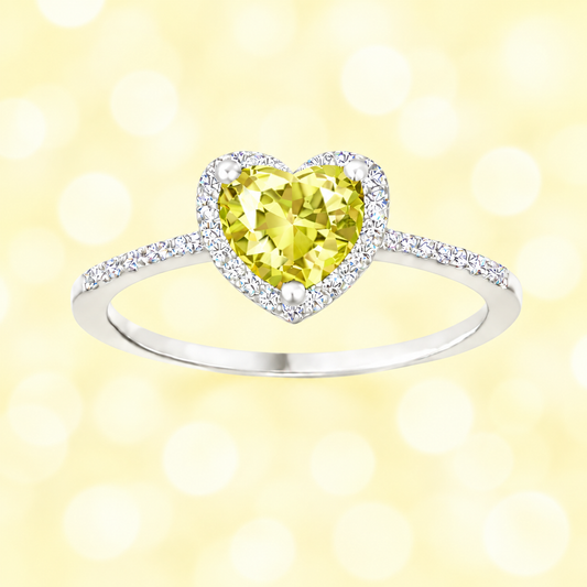 Lemon quartz ring with a 6 mm heart cut, crafted in white gold-plated 925 silver and accented with moissanite. Available now at BSI Jewelry.
