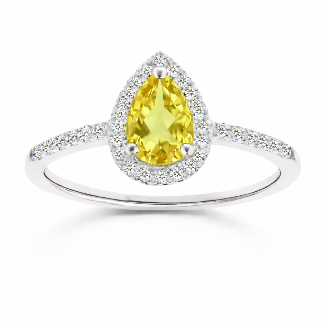 Lemon quartz ring with a 7×5 mm pear cut, with moissanite in white gold-plated 925 silver. Elegant and timeless for daily wear. Available now at BSI Jewelry.