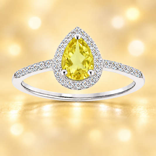 Lemon quartz ring with a 7×5 mm pear cut, with moissanite in white gold-plated 925 silver. Elegant and timeless for daily wear. Available now at BSI Jewelry.