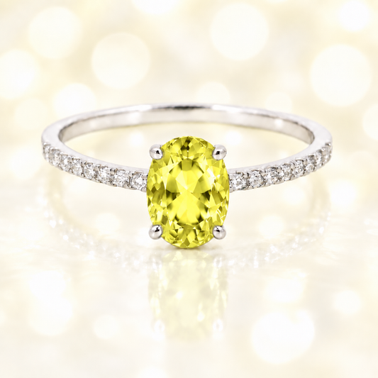 Lemon quartz ring with a 7×5 mm oval-cut stone and moissanite accents in white gold plated 925 silver. Elegant for daily wear. Available now at BSI Jewelry.