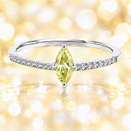 Lemon quartz ring with an 8×4 mm marquise-cut stone, accented by moissanite in white gold-plated 925 silver. Elegant and refined. Available now at BSI Jewelry.