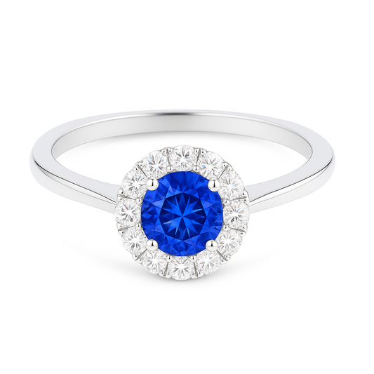 4.3 mm blue sapphire halo ring with white Moissanite in white gold-plated hypoallergenic 925 silver. Brilliant, elegant, timeless. Available now at BSI Jewelry.
