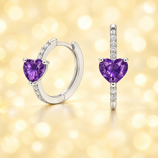 Elegant heart-cut Amethyst huggie earrings in white-gold-plated 925 silver with sparkling Moissanite accents for rich purple brilliance. Available at BSI Jewelry.