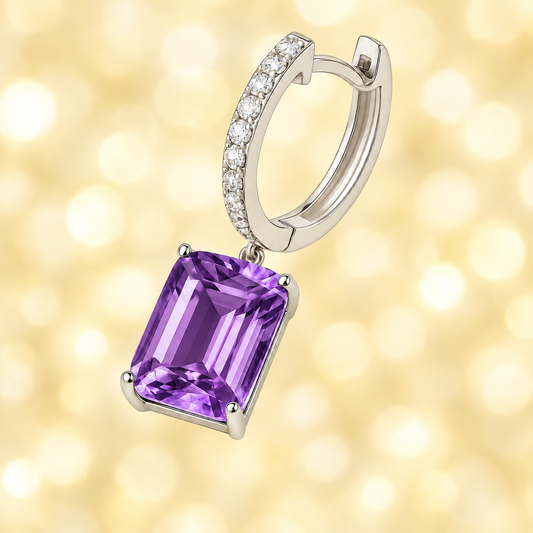 Moissanite & Amethyst Huggie Earrings, 8×6 mm emerald cut, crafted in white gold-plated 925 silver. Elegant and hypoallergenic. Available now at BSI Jewelry.