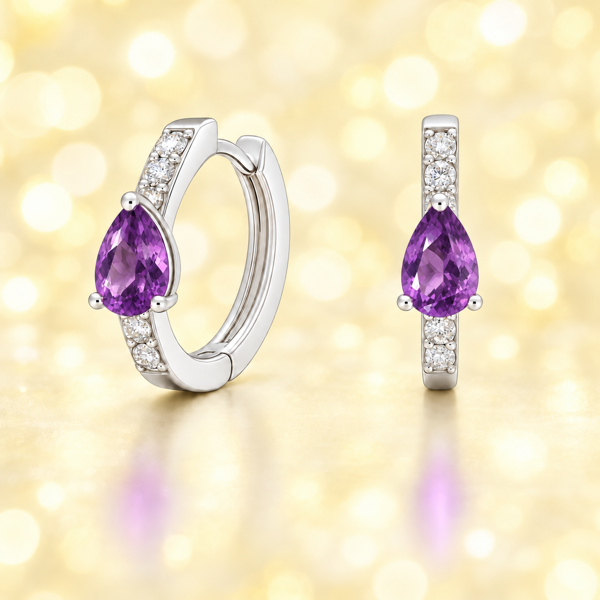 Delicate pear-cut amethyst huggie earrings in white gold-plated 925 silver with Moissanite accents for elegant everyday sparkle. Available at BSI Jewelry.