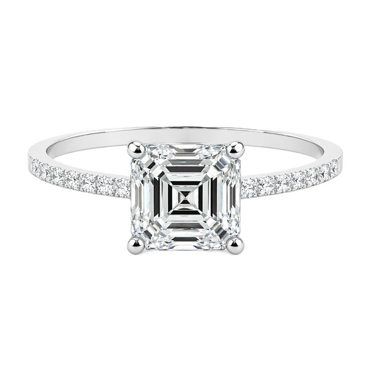 Moissanite asscher ring with a 6 mm asscher-cut stone, accented by moissanite in white gold-plated 925 silver. Sleek and refined. Available now at BSI Jewelry.