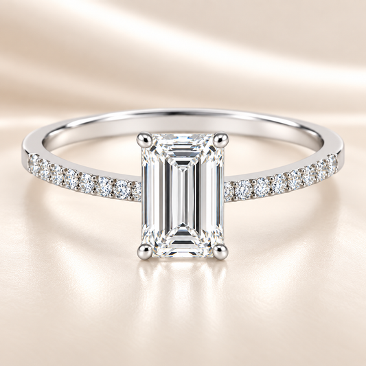 Moissanite baguette ring with a 7×5 mm baguette-cut stone, accented by moissanite in white gold-plated 925 silver. Sleek and modern. Available now at BSI Jewelry.