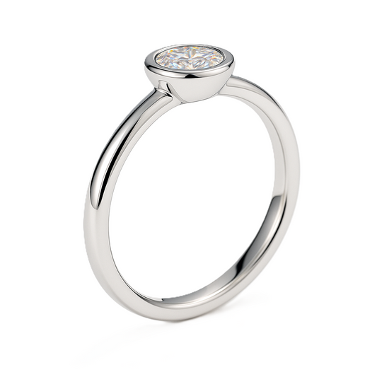 Moissanite bezel solitaire ring with a 3 mm round stone, crafted in white-gold-plated 925 silver. Elegant brilliance and timeless style. Available now at BSI Jewelry.