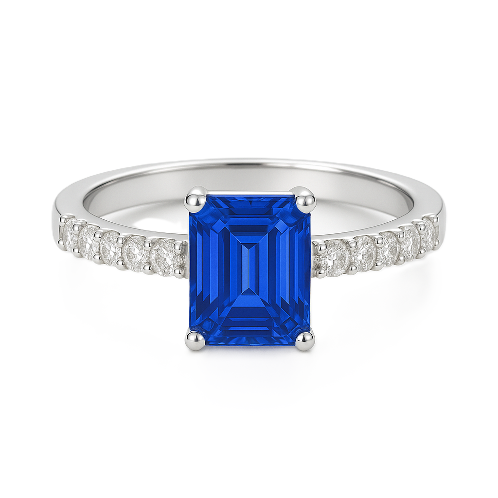 7×5mm emerald-cut Blue Sapphire ring with Moissanite accents in white-gold-plated 925 silver. Elegant, radiant, and hypoallergenic. Available at BSI Jewelry.