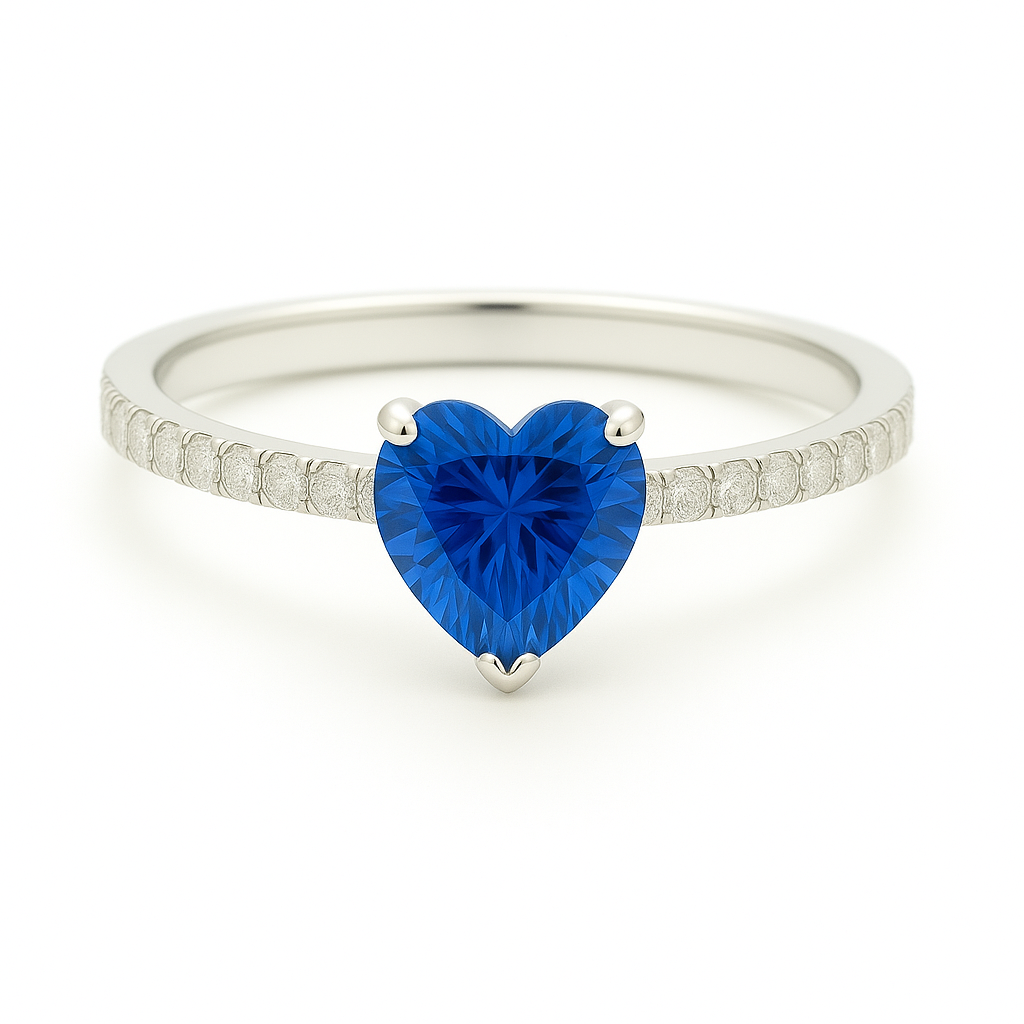 6mm heart-cut Blue Sapphire ring with Moissanite accents in white-gold-plated 925 silver. Elegant, timeless, and hypoallergenic. Available now at BSI Jewelry.