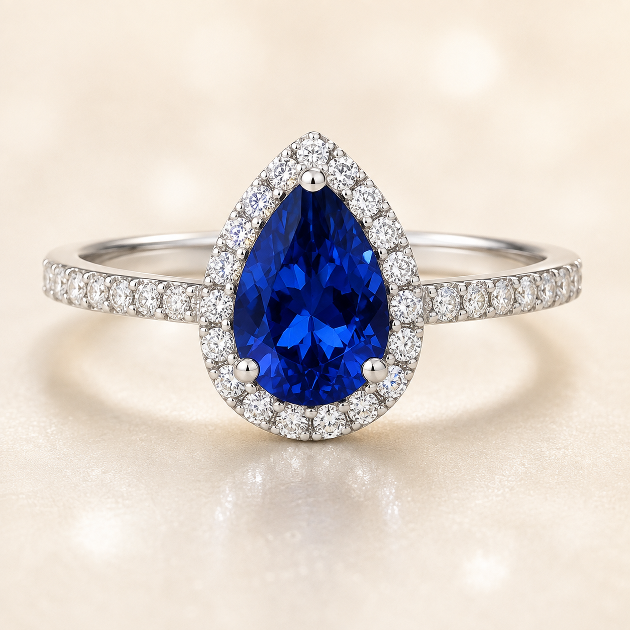 7×5 mm pear-cut blue sapphire ring with Moissanite halo in white-gold-plated 925 silver. Vivid brilliance and refined sparkle. Available now at BSI Jewelry.