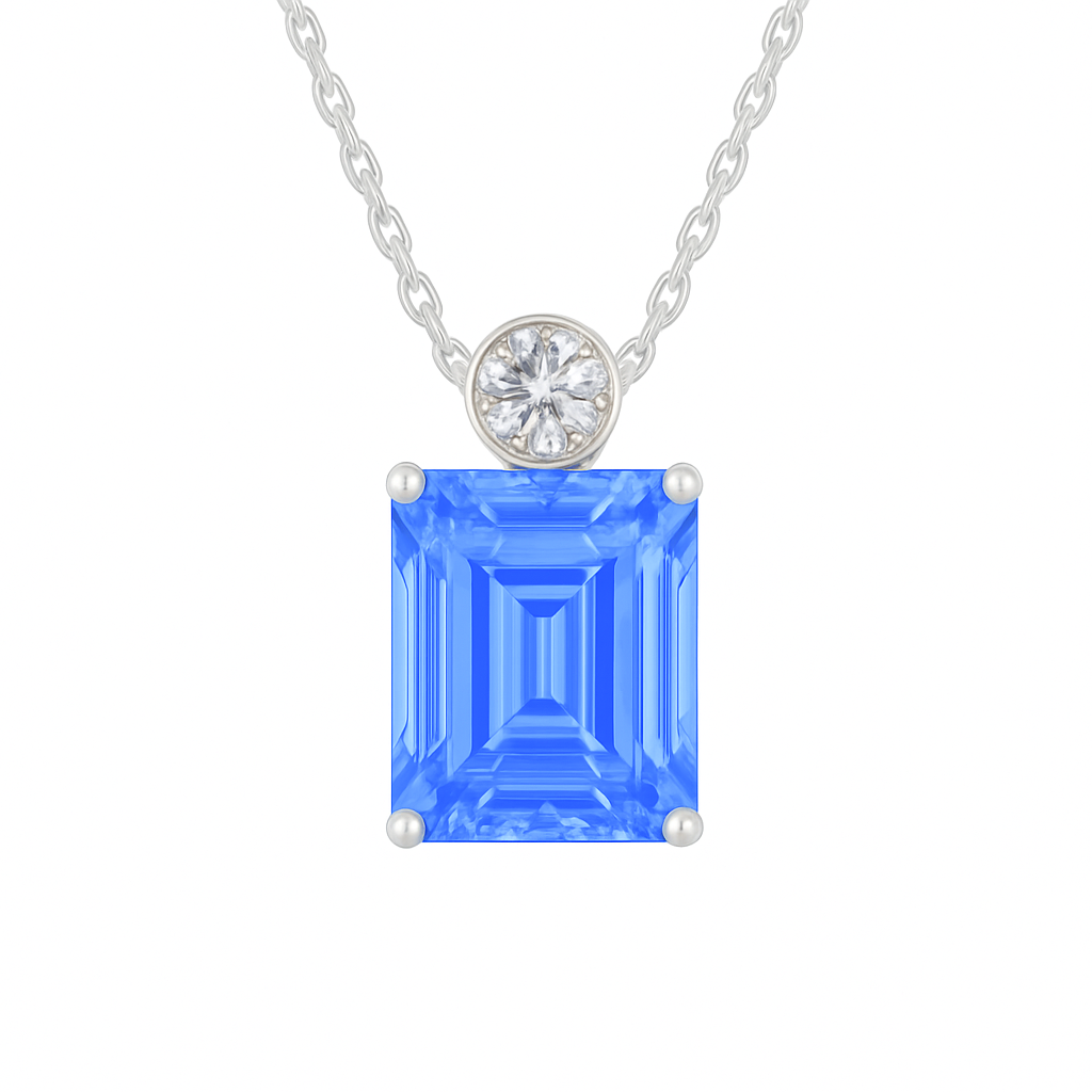 Blue sapphire & Moissanite pendant with 7×5 mm emerald-cut stone in white gold-plated 925 silver. Elegant sparkle and hypoallergenic. Available at BSI Jewelry.