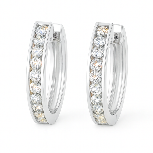 1.5 mm moissanite channel set huggies earrings in white gold-plated 925 silver. Sleek, refined and hypoallergenic for daily wear. Available now at BSI Jewelry.