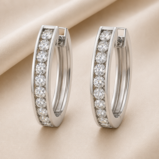 1.5 mm moissanite channel set huggies earrings in white gold-plated 925 silver. Sleek, refined and hypoallergenic for daily wear. Available now at BSI Jewelry.