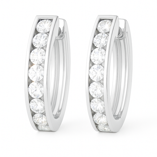 2.5 mm moissanite channel set huggies earrings in white gold-plated 925 silver. Sleek, refined and hypoallergenic for daily wear. Available now at BSI Jewelry.