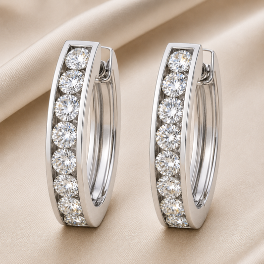 2.5 mm moissanite channel set huggies earrings in white gold-plated 925 silver. Sleek, refined and hypoallergenic for daily wear. Available now at BSI Jewelry.