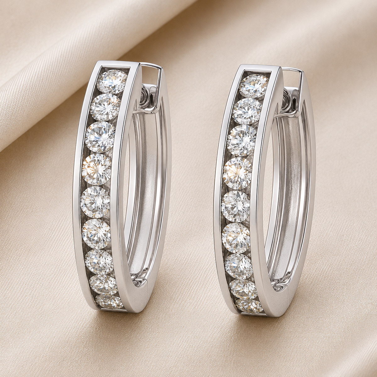 2 mm moissanite channel set huggies earrings in white gold-plated 925 silver. Sleek, refined and hypoallergenic for daily wear. Available now at BSI Jewelry.