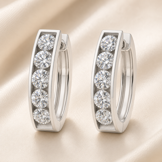 3.5 mm moissanite channel set huggies earring in white gold-plated 925 silver. Sleek, refined and hypoallergenic for daily wear. Available now at BSI Jewelry.