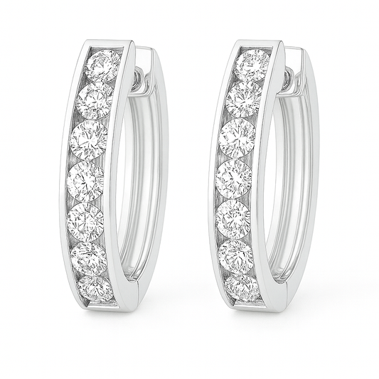 3 mm moissanite channel set huggies earrings in white gold-plated 925 silver. Sleek, refined and hypoallergenic for daily wear. Available now at BSI Jewelry.
