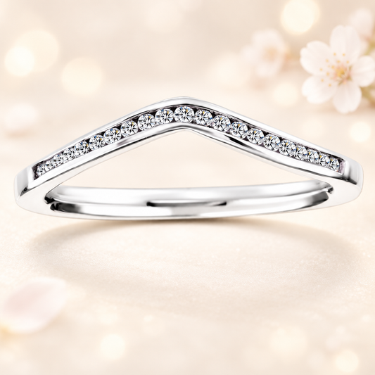 A modern chevron wedding band with 19 Moissanite stones totaling 0.10 carat, crafted in white-gold-plated 925 silver for refined sparkle and elegance.
