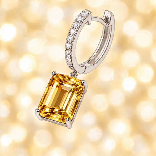 Moissanite & Citrine Huggie Earrings, 8×6 mm emerald cut, crafted in white gold-plated 925 silver. Stylish and hypoallergenic. Available now at BSI Jewelry.