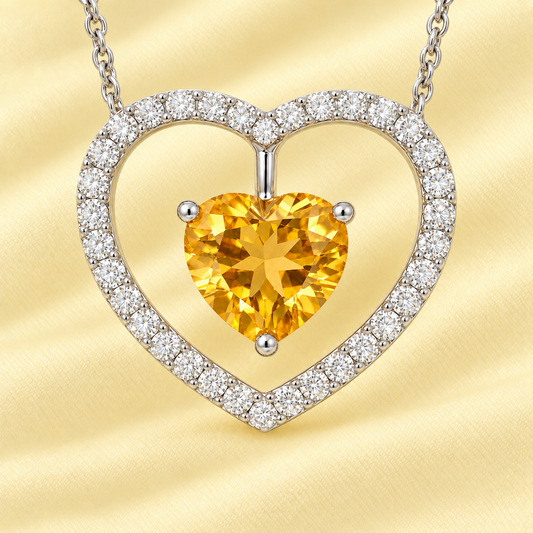 Moissanite and citrine necklace with a 6 mm heart-cut gemstone in white gold-plated 925 silver. Warm and elegant. Available now at BSI Jewelry.