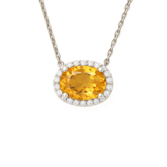 Moissanite and citrine necklace with 9×7 mm oval gemstone in white gold-plated 925 silver, accented with moissanite. Warm and elegant. Available now at BSI Jewelry.
