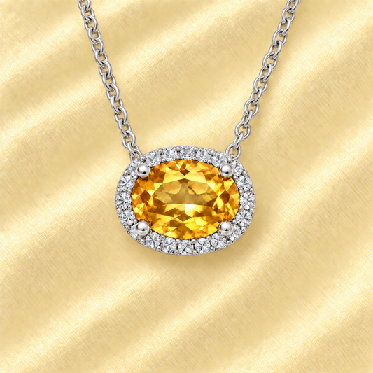 Moissanite and citrine necklace with 9×7 mm oval gemstone in white gold-plated 925 silver, accented with moissanite. Warm and elegant. Available now at BSI Jewelry.
