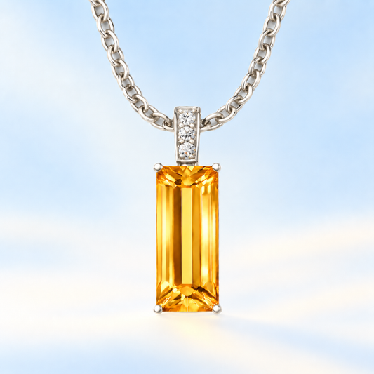 Moissanite and citrine pendant with a 14 × 6 mm baguette-cut gemstone in white gold-plated 925 silver. Modern and elegant. Available now at BSI Jewelry.