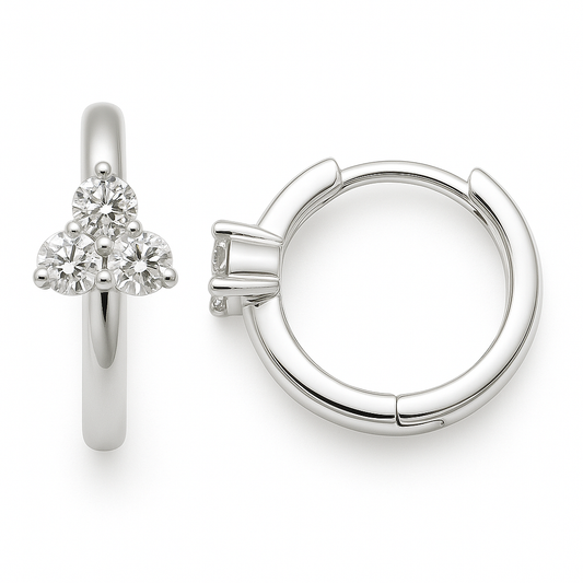 Chic Moissanite cluster huggie earrings in 925 silver with a sparkling trio of stones on sleek hoops. Elegance and radiant style. Available now at BSI Jewelry.