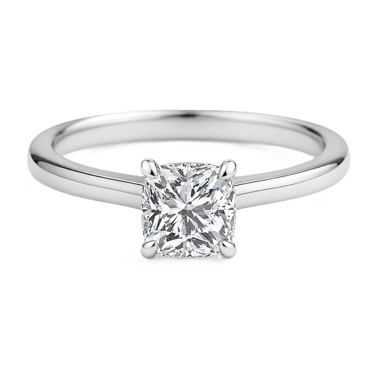 Elegant 5 mm cushion-cut Moissanite solitaire in white gold-plated 925 silver with palladium-added alloy. Hypoallergenic and timeless. Available at BSI Jewelry.