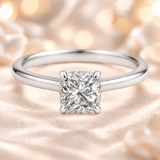 7 mm cushion-cut Moissanite solitaire in white gold-plated 925 silver with palladium-added alloy. Elegant, bold, and hypoallergenic. Available now at BSI Jewelry.